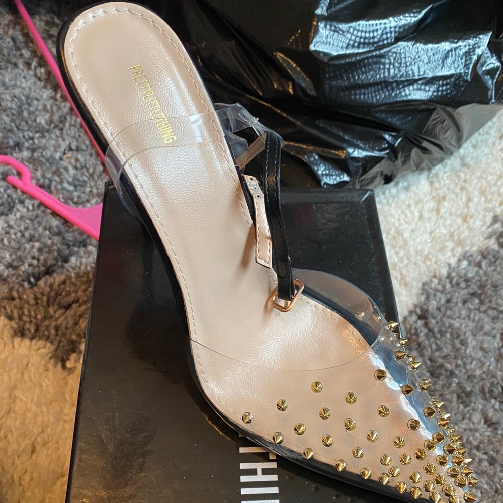 Black Studded Clear Heels. Runs 1/2 small.